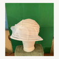 White sheer sculptural cloche-style occasion hat with layered translucent bands and bow detail, pre-owned.