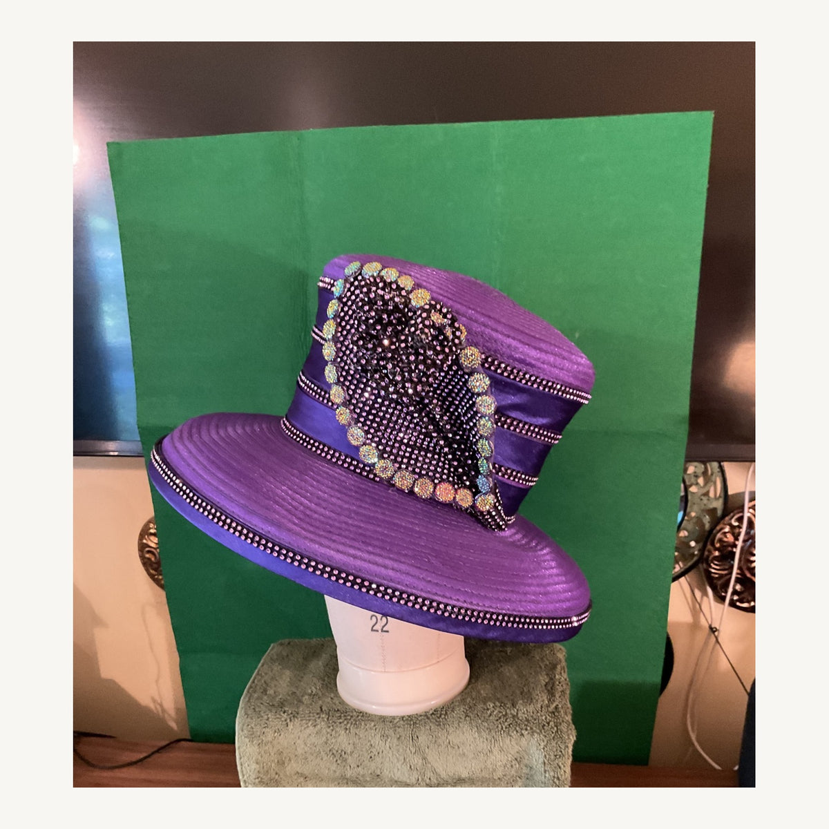 Purple wide-brim occasion hat with crystal trim and dramatic jeweled side embellishment, pre-owned.