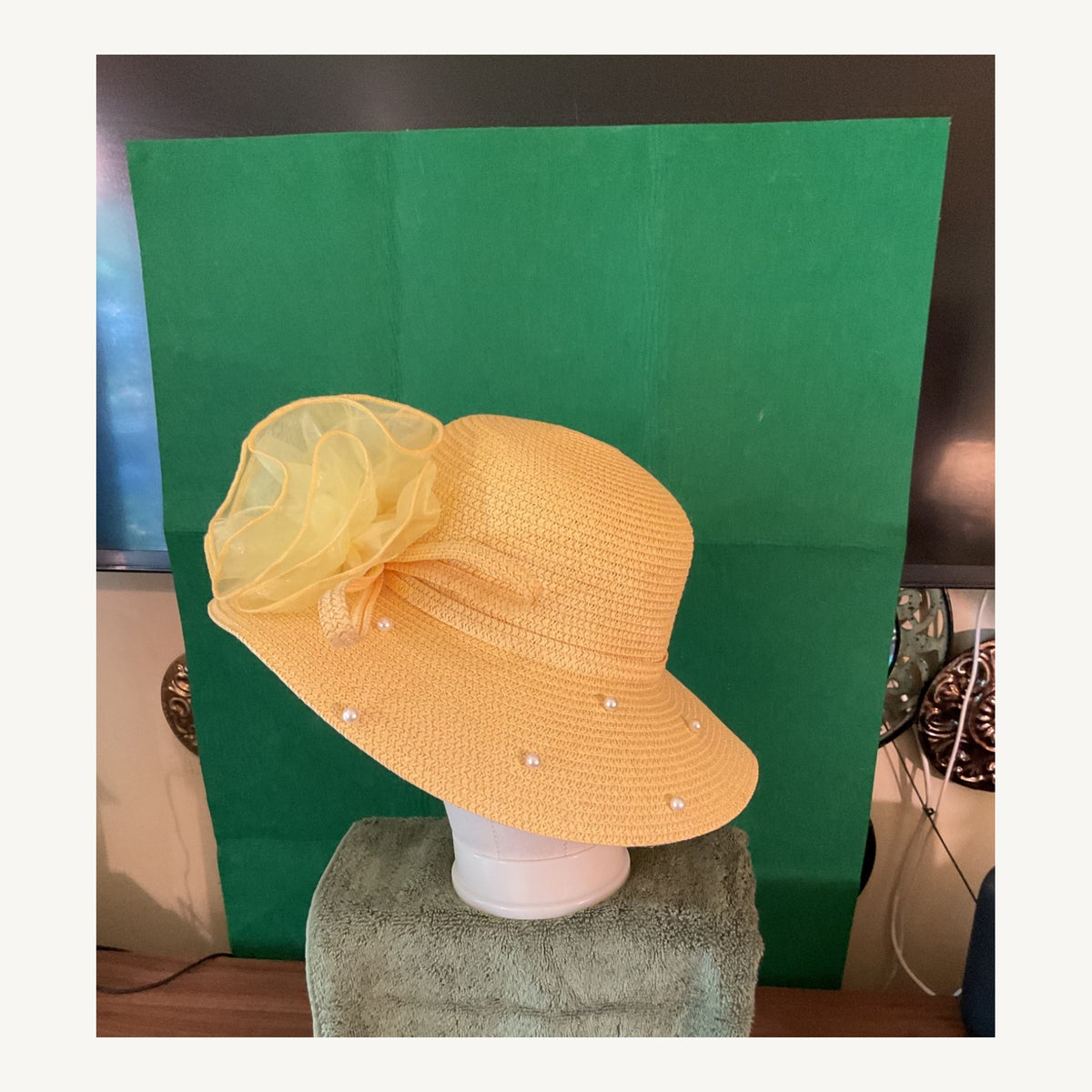 Yellow wide-brim occasion hat with pearl accents and large organza flower, pre-owned.