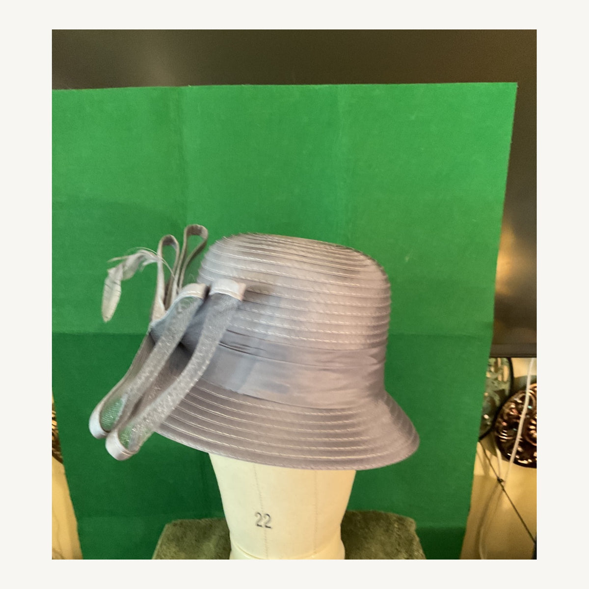 Silver-gray structured dress hat with oversized mesh bow detail, pre-owned.