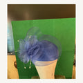Navy blue fascinator-style occasion hat with large organza floral loops and pearl-tipped accents, pre-owned.